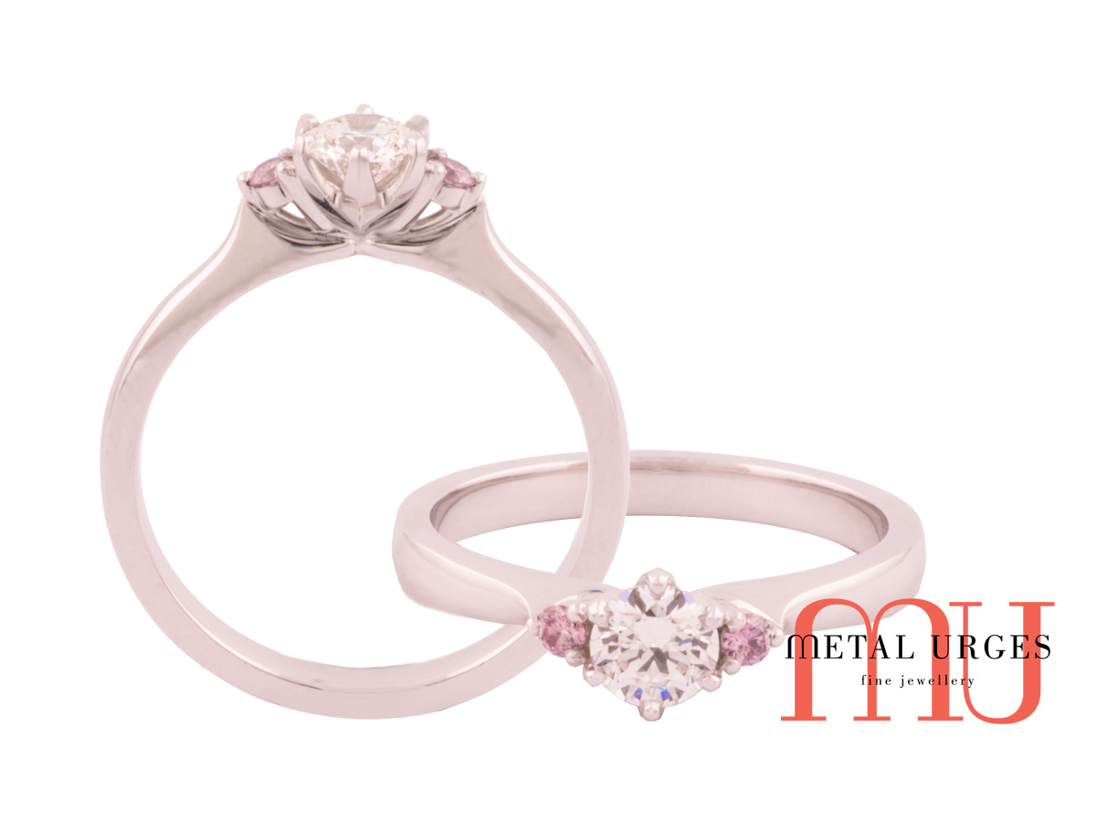 Pink diamond Australian Argyle and white diamond in platinum engagement ring.