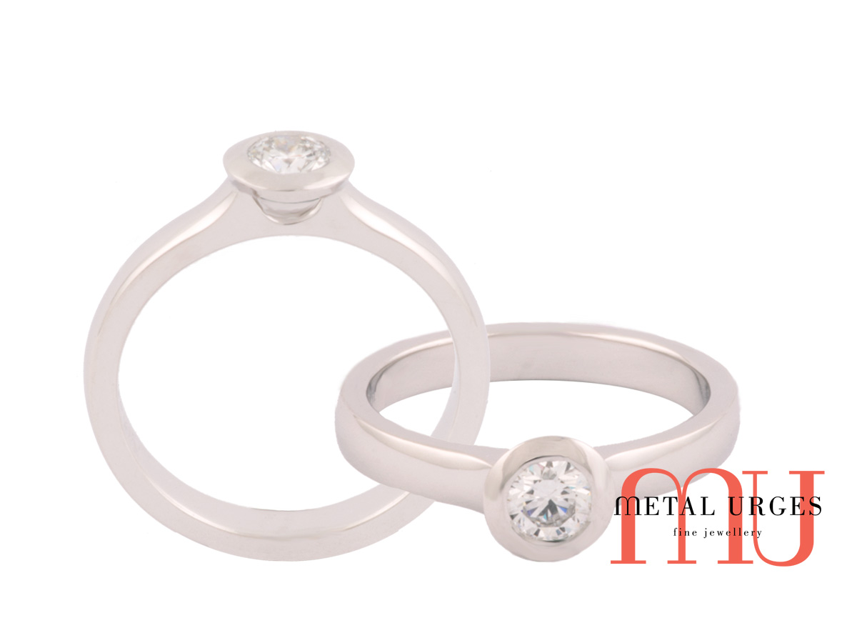 Certified round white diamond bezel set in 18ct white gold ring