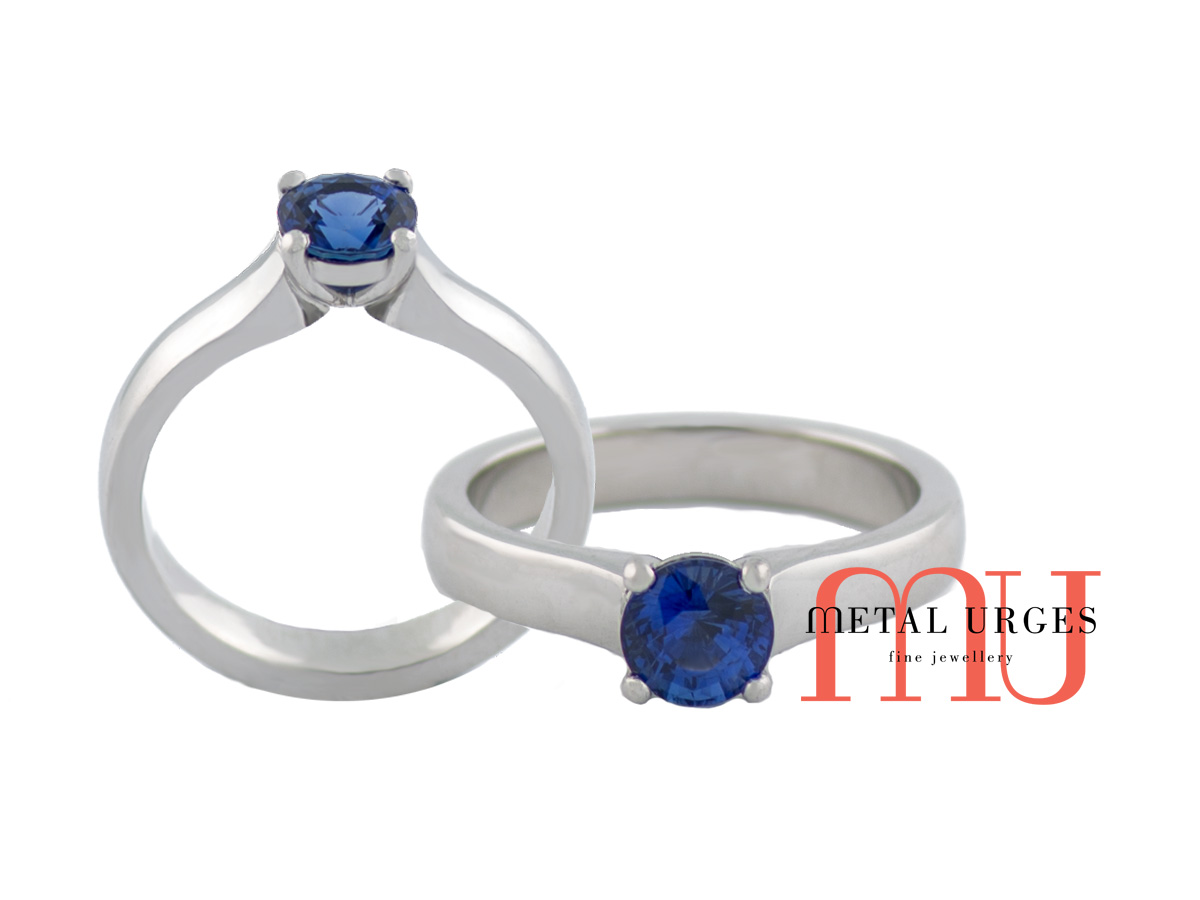 Natural blue sapphire hand set in elegant white gold ring.