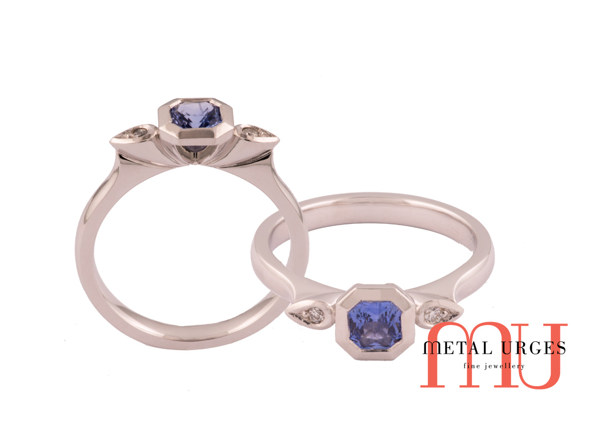 Geometric octagonal natural sapphire with pear diamonds in 18ct white gold.