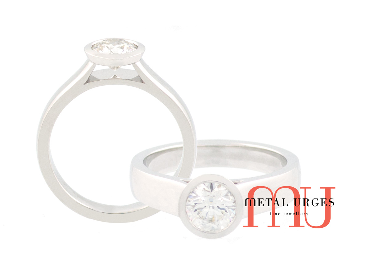 Round brilliant GIA certified white diamond half bezel set engagement ring