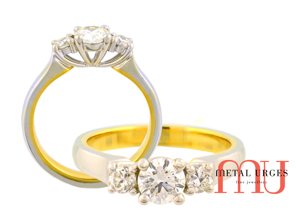Three stone round brilliant cut GIA certified white diamond engagement ring in 18ct white and yellow gold. Custom made in Australia.