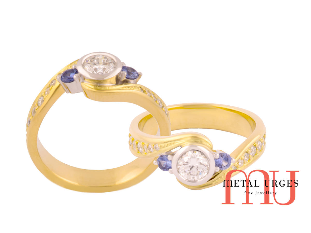 Diamond rings Melbourne with sapphire round stones set each side