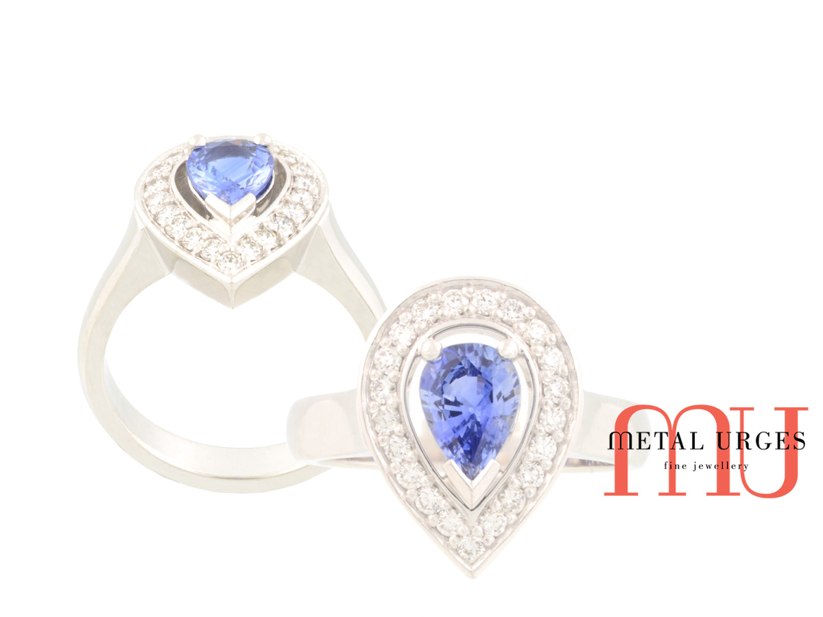 Halo blue sapphire and white diamond platinum engagement ring. Custom made in Australia.