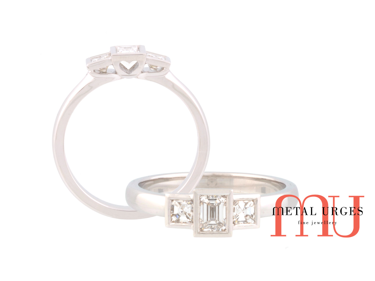 Three stone emerald cut white diamond platinum engagement ring with square emerald cut white diamonds.  Custom made in Hobart.