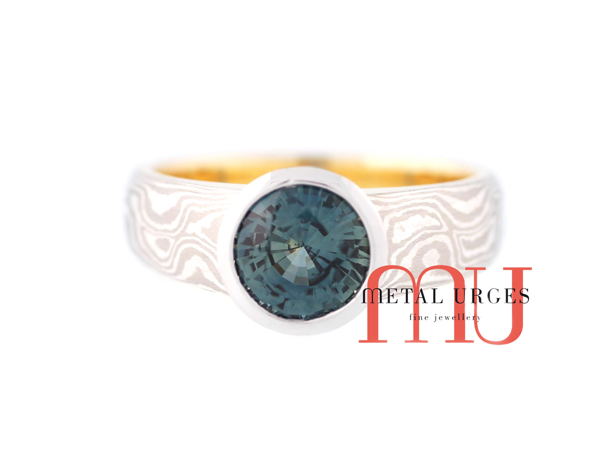 Mokume gane and green sapphire engagement ring. Custom made in Australia.