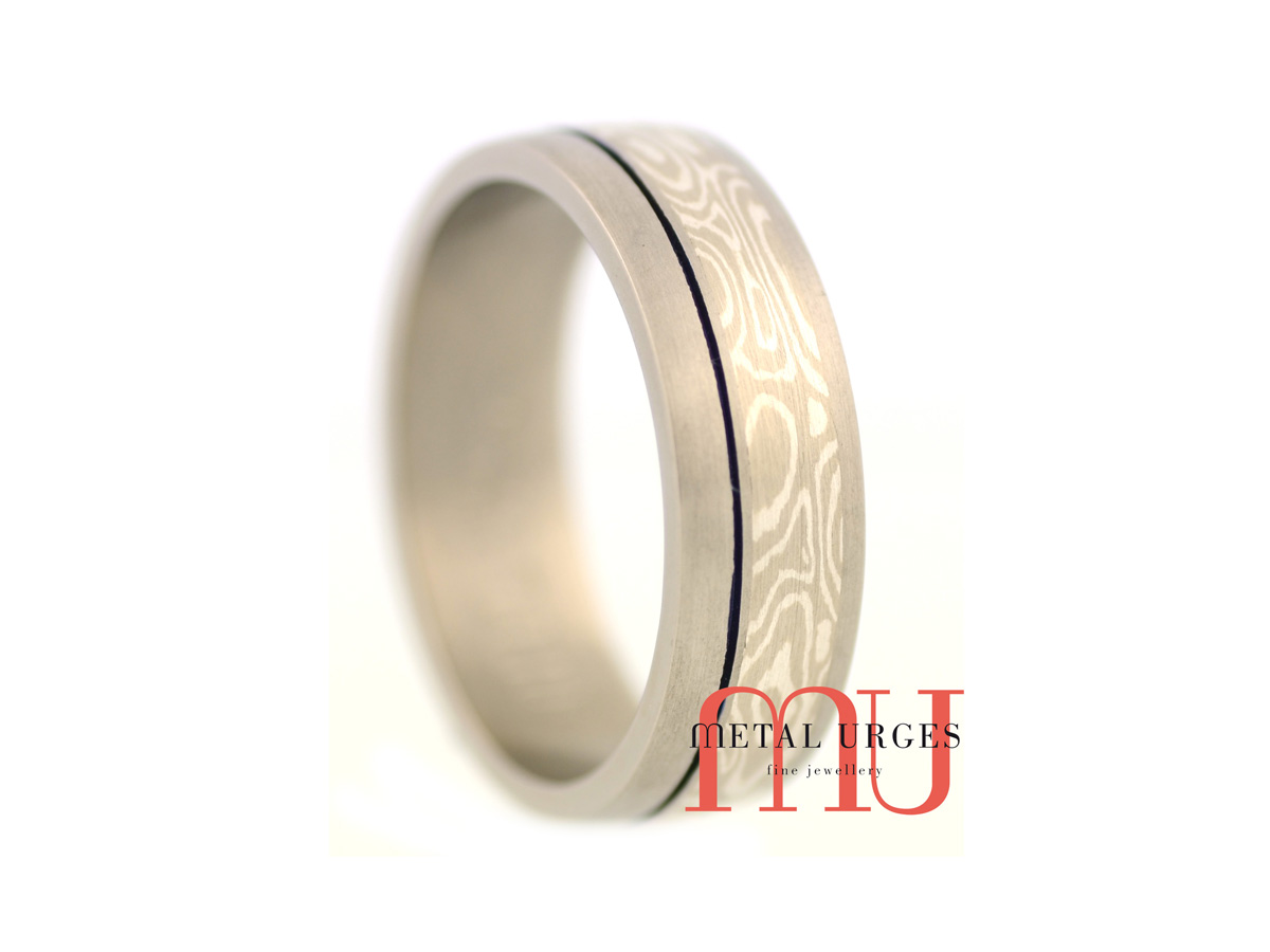 Mokume Gane and titanium wedding ring with blue groove. Custom made in Australia.