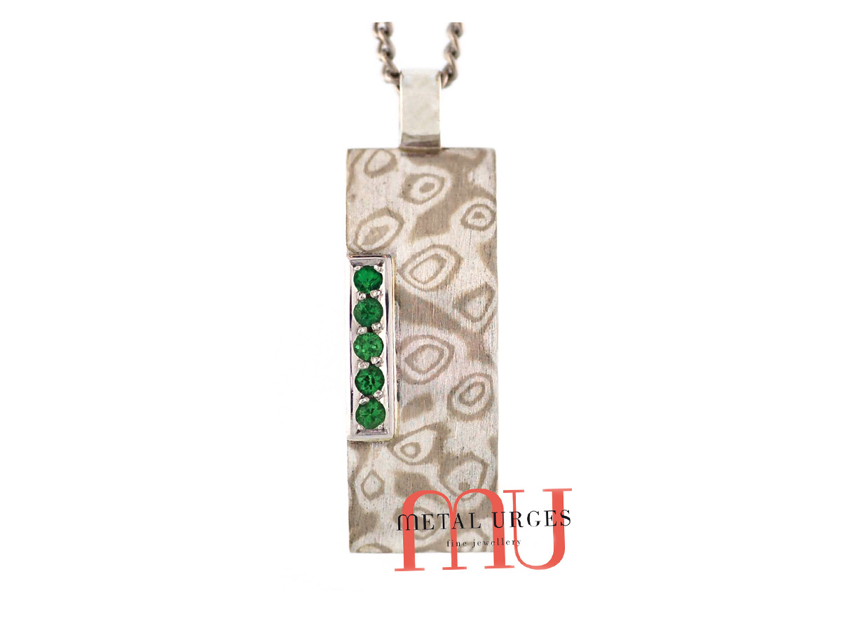 Mokume Gane pendant and natural Tsavorite garnets. Custom made in Australia.