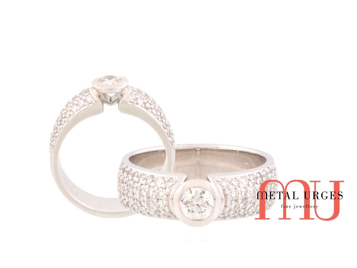 White diamond platinum engagement ring with a pave set white diamond band. Custom made in Australia.