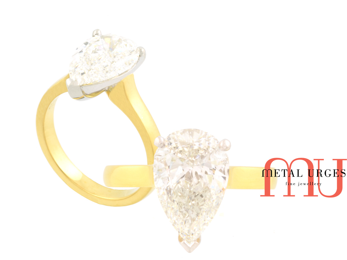 GIA certified pear shaped white diamond engagement ring. Created in 18ct yellow and white gold. Custom made in Australia.