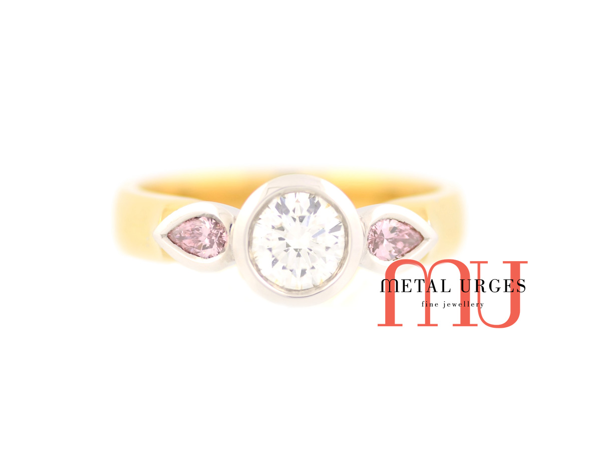 Pink diamond ring. Round brilliant cut white and Argyle pink diamond engagement ring in 18ct yellow and white gold. Custom made in Australia.