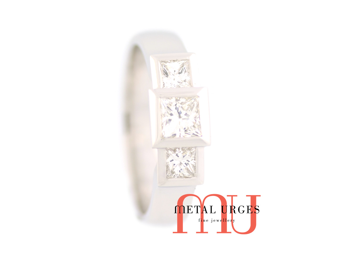 Platinum engagement ring, three bezel set princess cut white diamonds.  Custom made in Hobart.