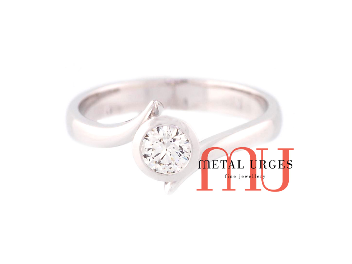 Brilliant cut white diamond and 18ct white gold solitaire engagement ring. Custom made in Australia.