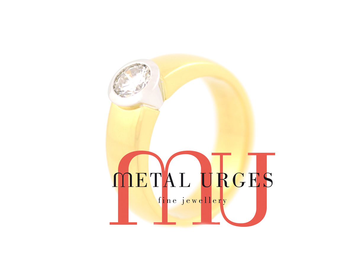 Round brilliant cut white diamond engagement ring in 18ct white and yellow gold. Custom made in Australia.