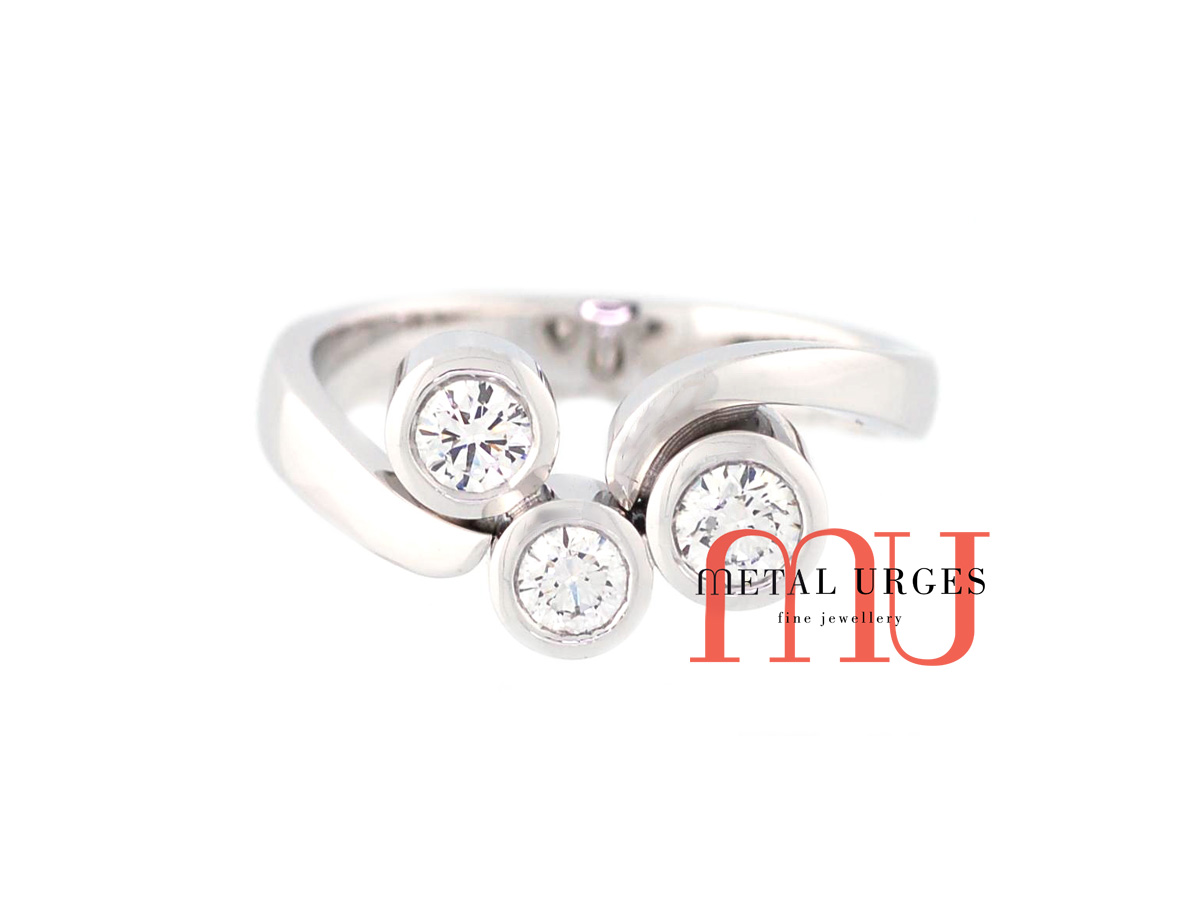 Three stone engagement, anniversary or dress ring.  Round brilliant cut white diamonds bezel set in 18ct white gold.  Custom made in Hobart.