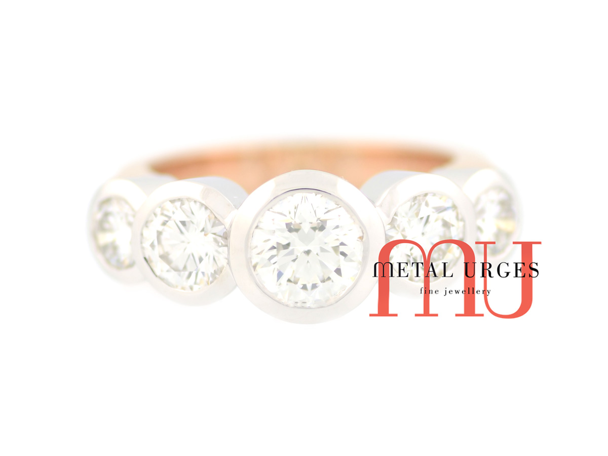 Five stone engagement ring.  Five brilliant cut white diamonds bezel set in 18ct white gold on an 18ct rose gold band.  Custom made in Hobart.