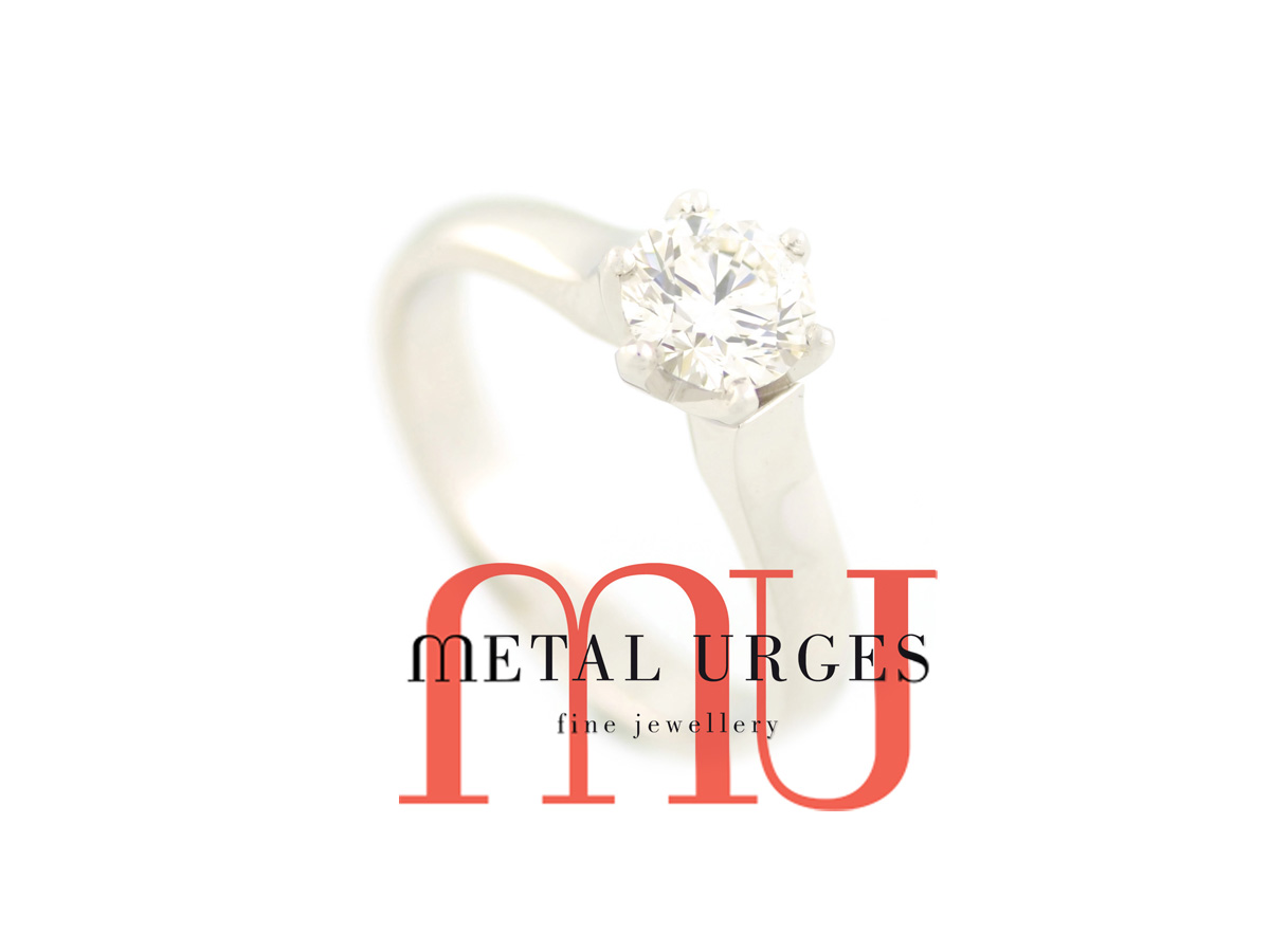 Solitaire brilliant cut white diamond and platinum engagement ring.  Hand made in Australia.