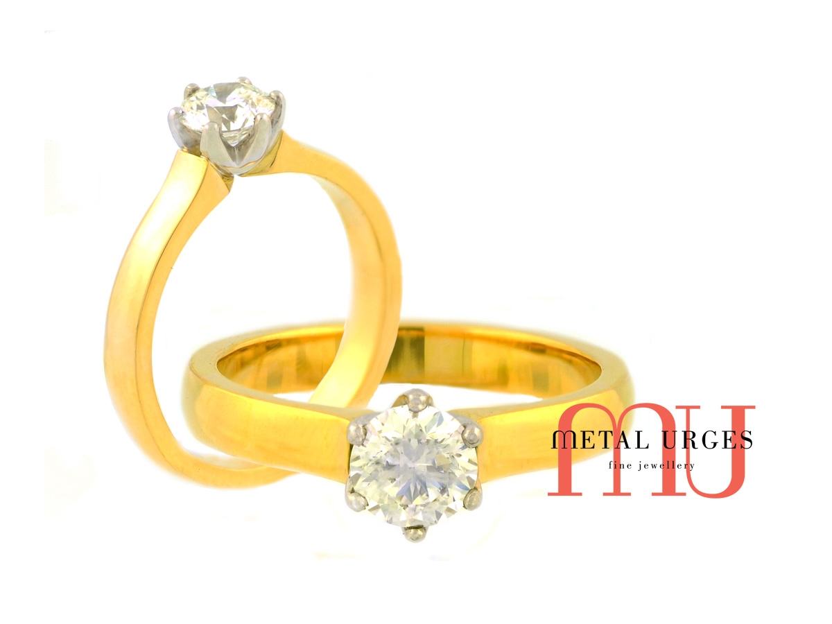 Tiffany inspired natural round brilliant cut GIA certified white diamond, six claw set in Platinum with an 18ct yellow gold solitaire engagement ring. Custom made in Australia.