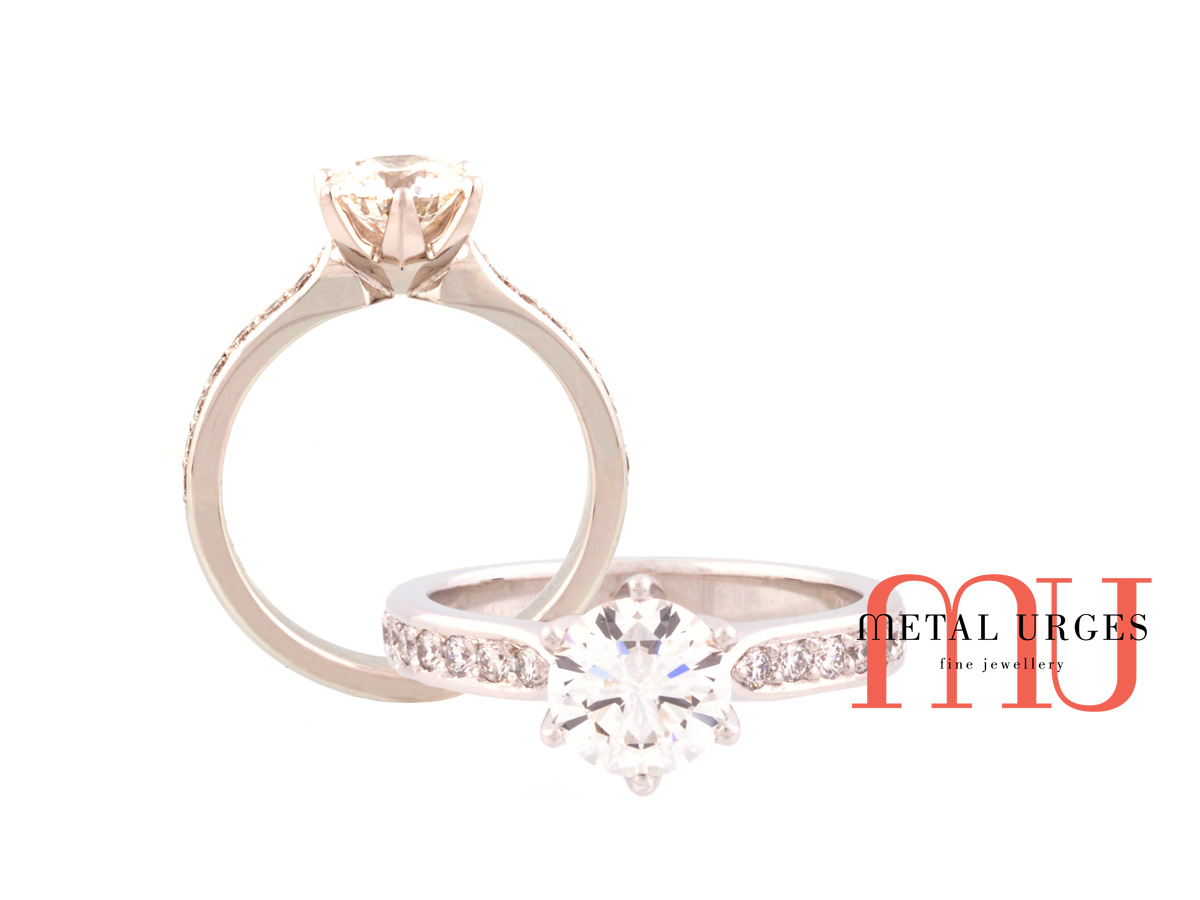 Round brilliant cut white diamond engagement ring, six claw set in platinum. Custom made in Australia.