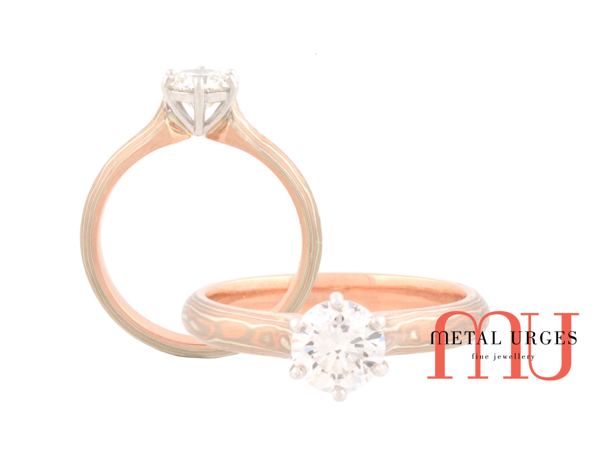 Unique solitaire round brilliant cut white diamond and Mokume Gane engagement ring. Custom made in Australia.