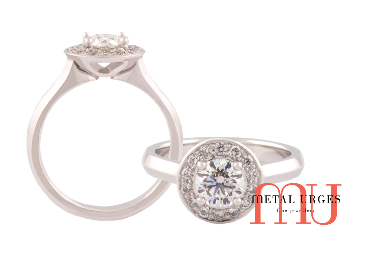 White diamonds in white gold designer cluster engagement ring.