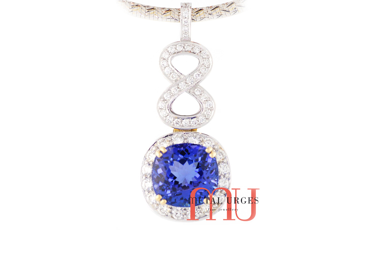 Natural blue sapphire and diamond pendant in 18ct white gold. Custom made in Australia.