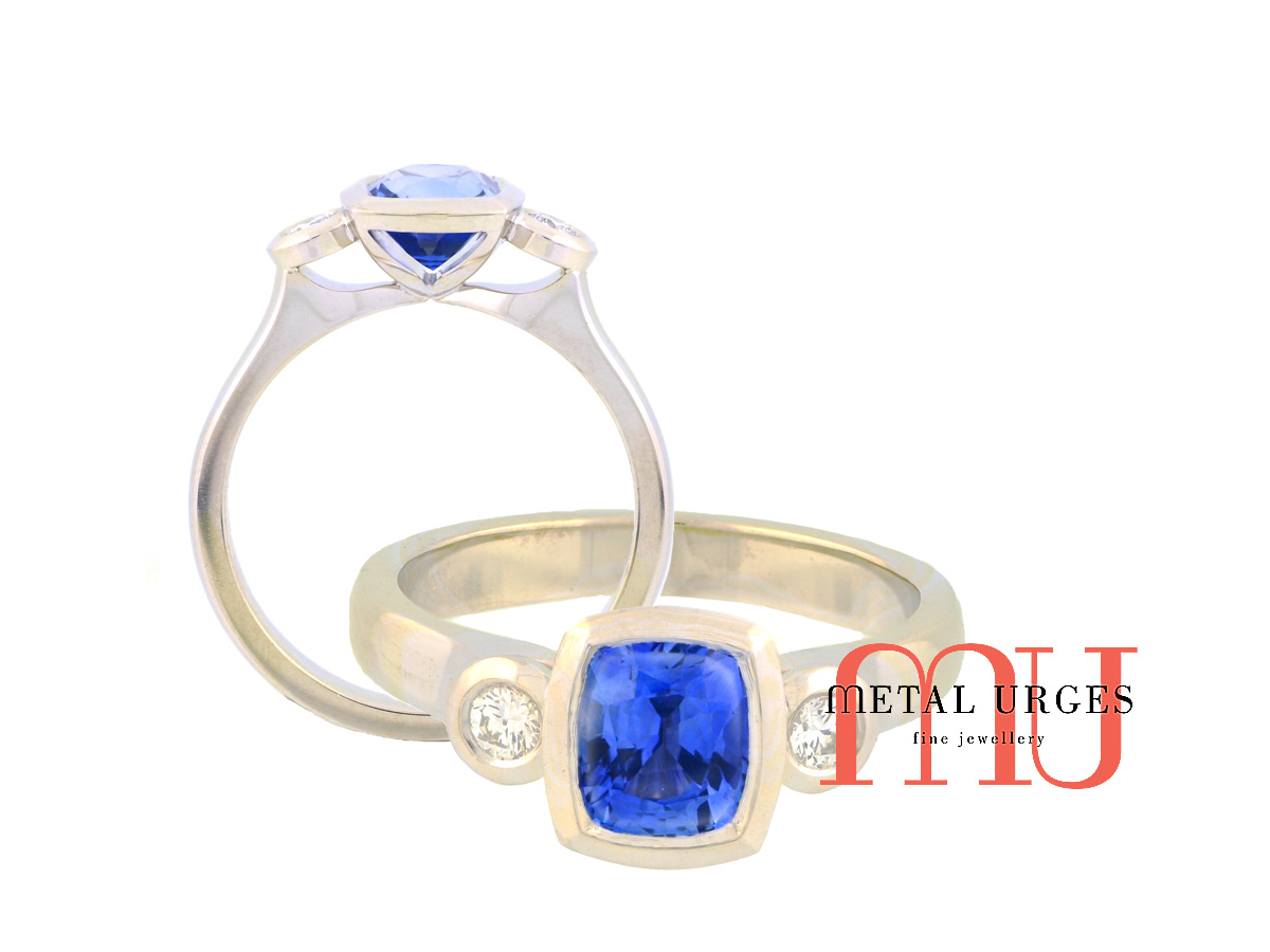Vibrant blue sapphire and white diamond modern cluster engagement ring. Custom made in Australia.