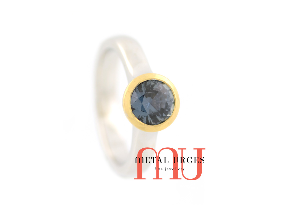 Blue green round sapphire engagement ring in 18ct white and yellow gold. Custom made in Australia.