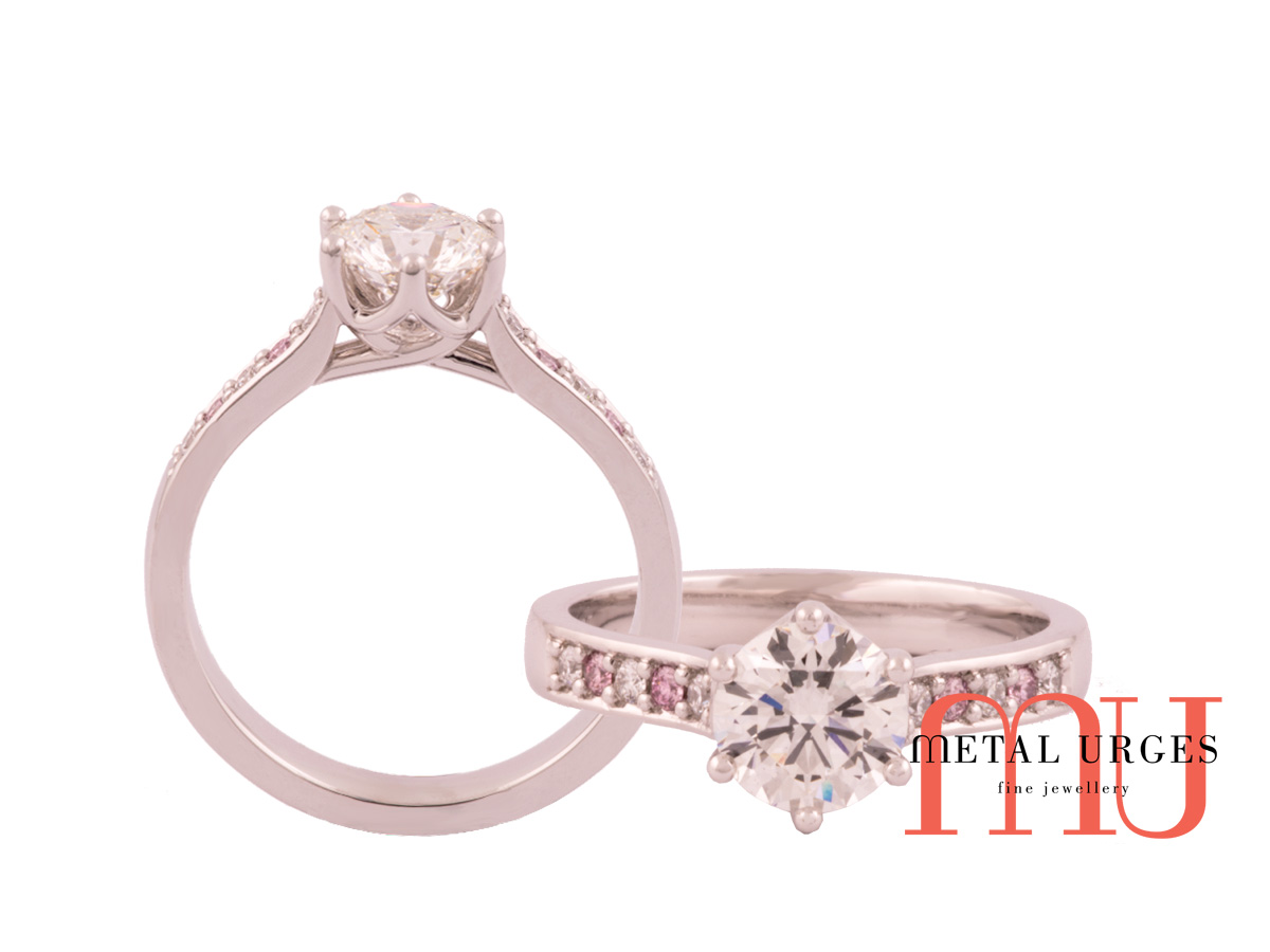 Six claw lucida style setting white diamond with pink argyle diamonds ring set in 18ct white gold