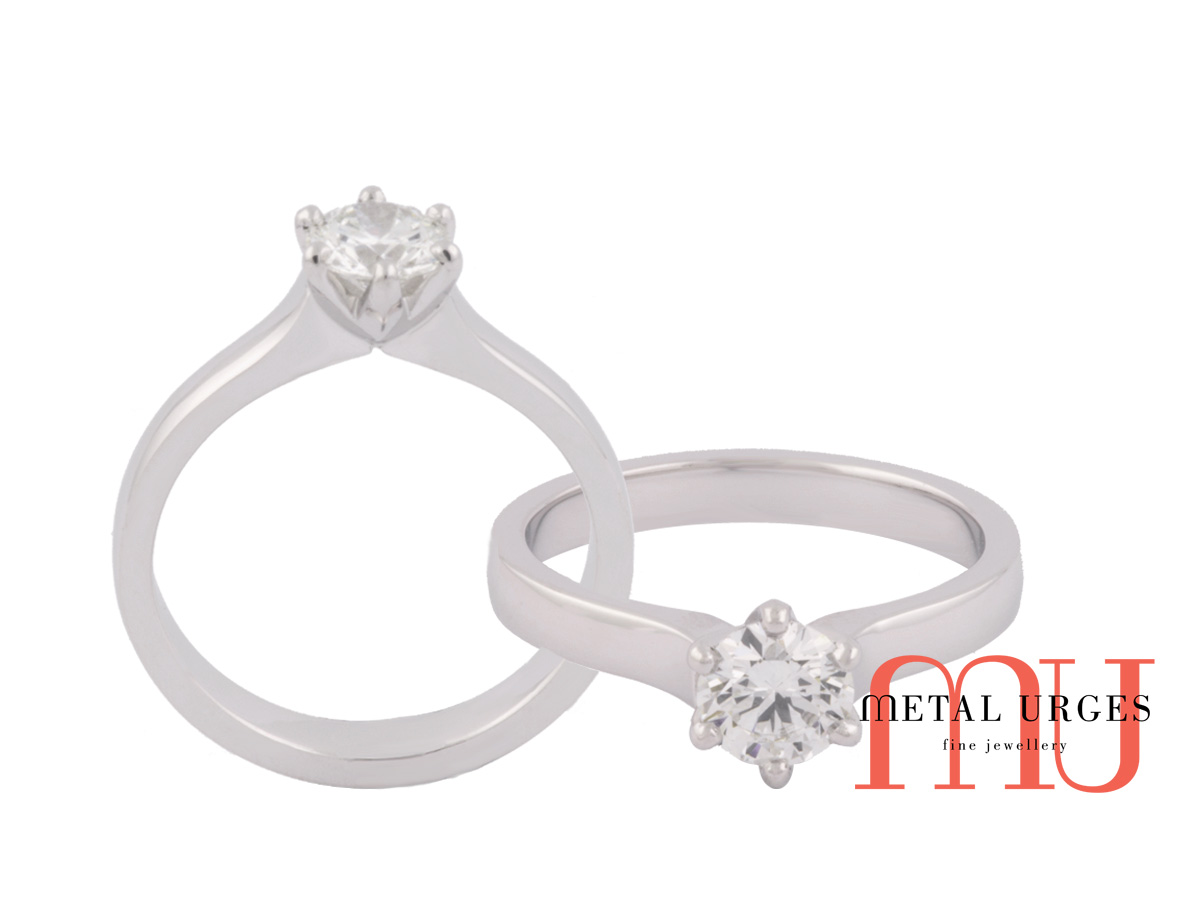 Round brilliant cut white diamond six claw engagement ring