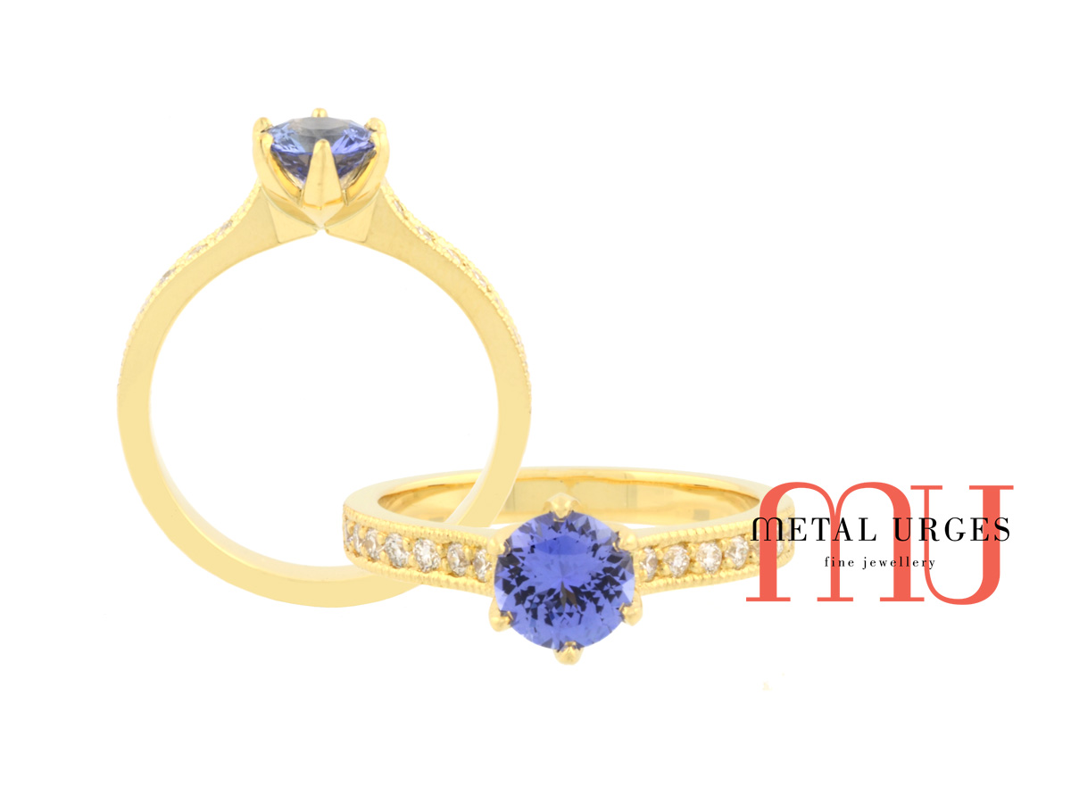 Vibrant blue sapphire and white diamond engagement ring in 18ct yellow gold. Handmade by our Jewellers, in Hobart Tasmania.
