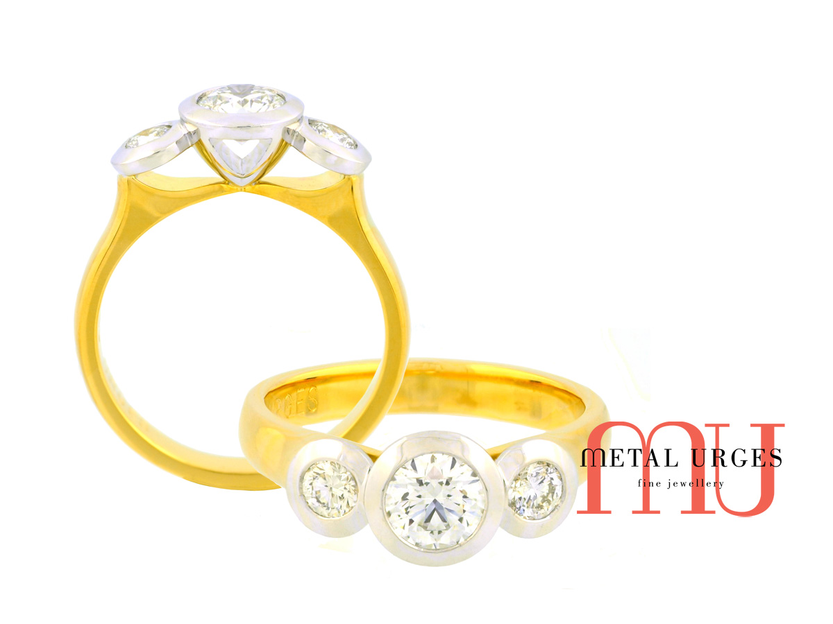 Three stone engagement ring.  GIA certified round brilliant cut white diamonds set in platinum with an 18ct yellow gold band.  Hand made in Hobart, Tasmania.