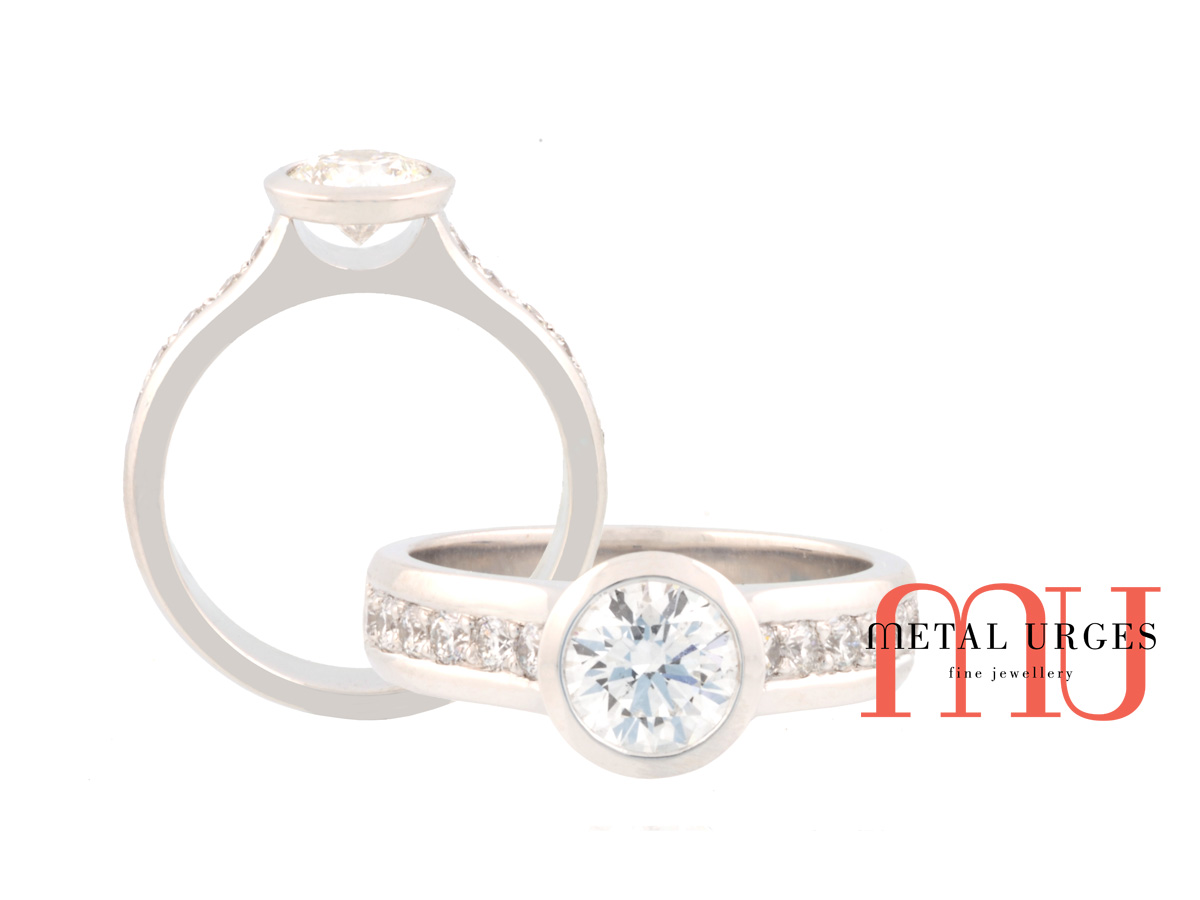 Round brilliant cut white diamond and platinum engagement ring.  Custom made in Australia.
