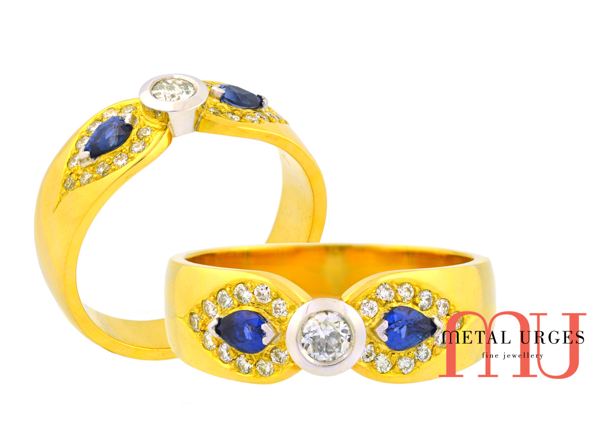 Designer dress ring featuring natural round white diamond with a matched pear shaped Sri Lankan blue sapphires in 18ct yellow and white gold.  Custom made in Hobart.